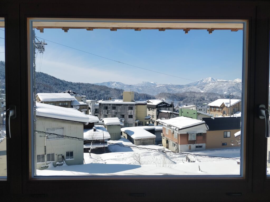 View from Tamanegi house (Nozawa) looking over the town and mountains.